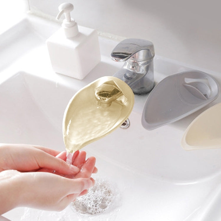 Beige toddler faucet handle extender with angled splash spout, snap-on design