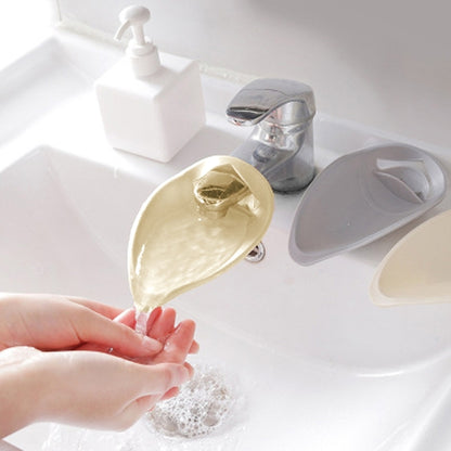 Beige toddler faucet handle extender with angled splash spout, snap-on design