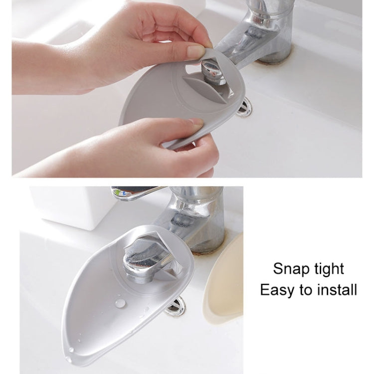 Gray toddler faucet extender snapping onto bathroom sink spout handle