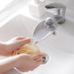 Beige faucet handle extender for toddler sink, attached to chrome faucet