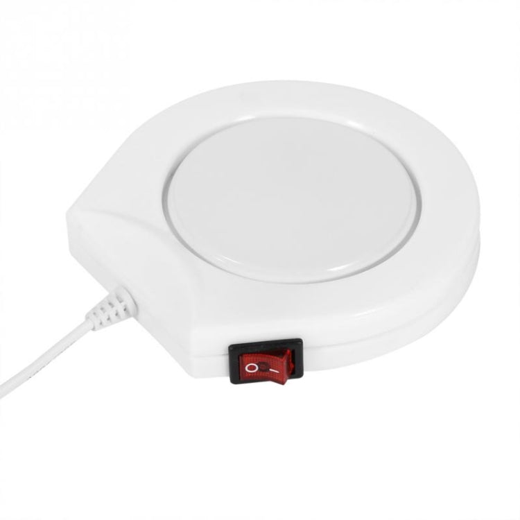 White electric beverage warmer with circular top and red power switch