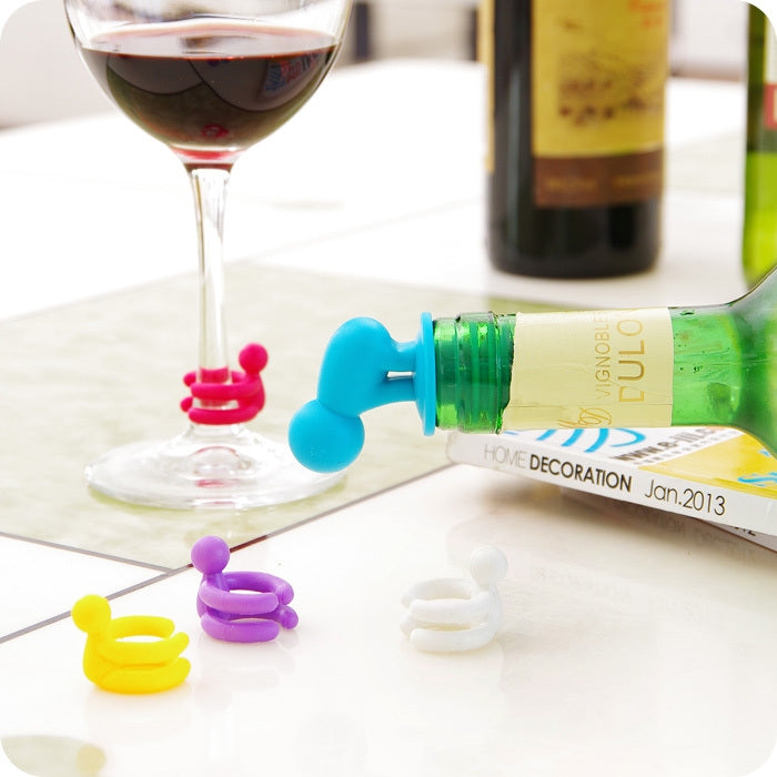 Green and blue cartoon silicone spiral wine stoppers inserted on wine bottles