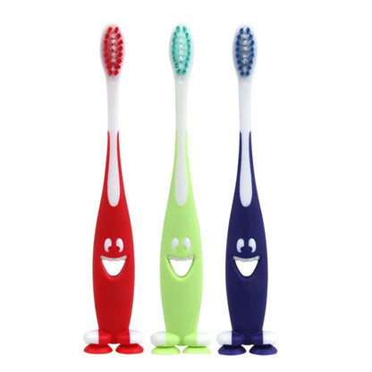 Three children's cartoon toothbrushes: red, green, and blue with character faces.
