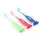 Three children’s toothbrushes with character mouths, red, green, and blue handles.