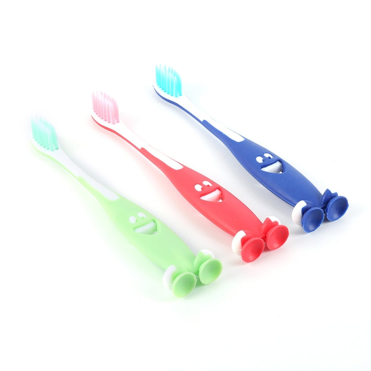 Three children’s toothbrushes with character mouths, red, green, and blue handles.