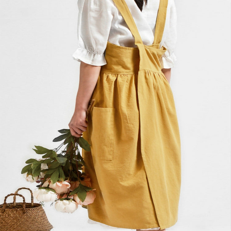 Ginger cotton-linen apron with adjustable straps, gathered waist, and front pocket
