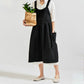 Black high-waist cotton-linen apron with bib front, gathered skirt, and side pockets