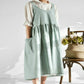 Mint high-waist cotton-linen apron with bib front, gathered skirt, and side pocket