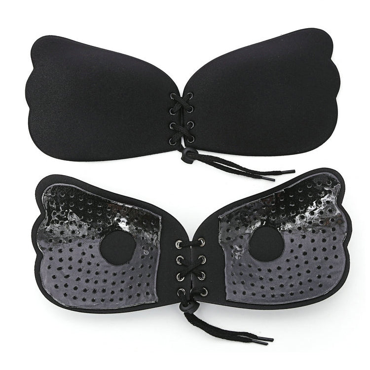 Pair of black lace-up silicone nubra cups with pull ropes and central eyelets
