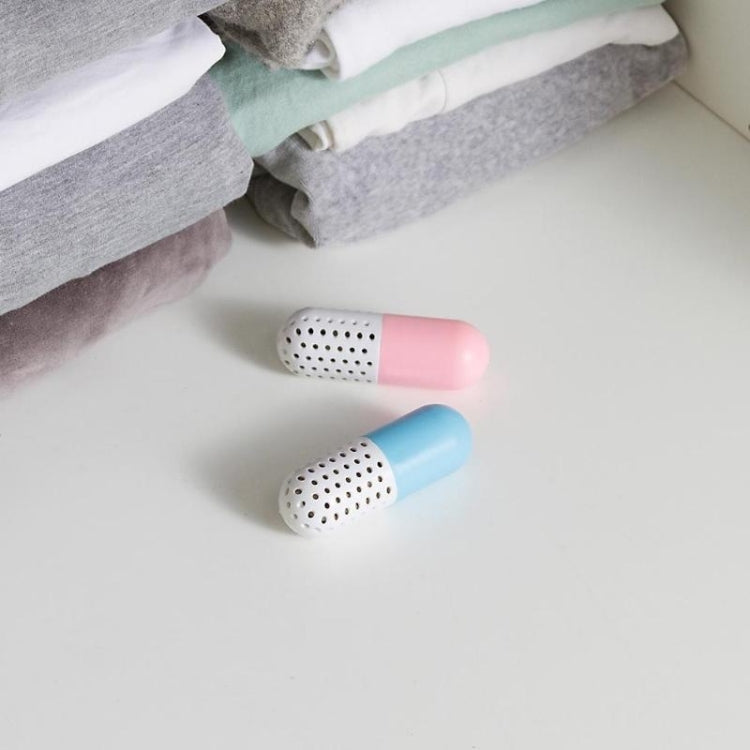 Two capsule shoe deodorizers, pink and blue with perforated vent ends