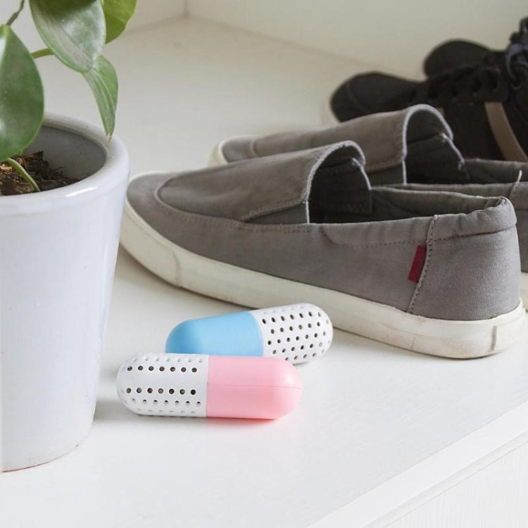 Capsule shoe deodorizers in pink and blue with perforated vent holes