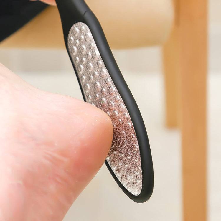 Foot file close-up showing silver dimpled abrasive pad on black frame