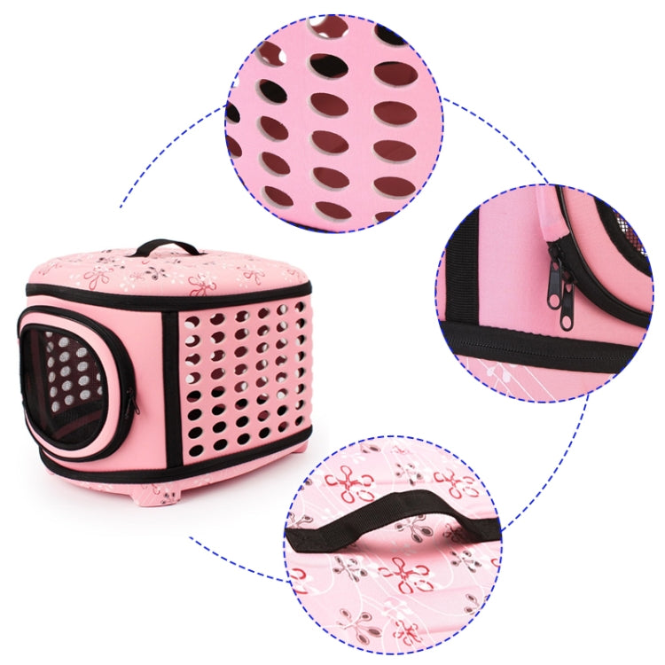 Pink folding pet carrier with vented side panel, mesh window, and zippered front pocket detail.