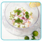 Frozen fruit ice cubes with mint leaves in a glass bowl