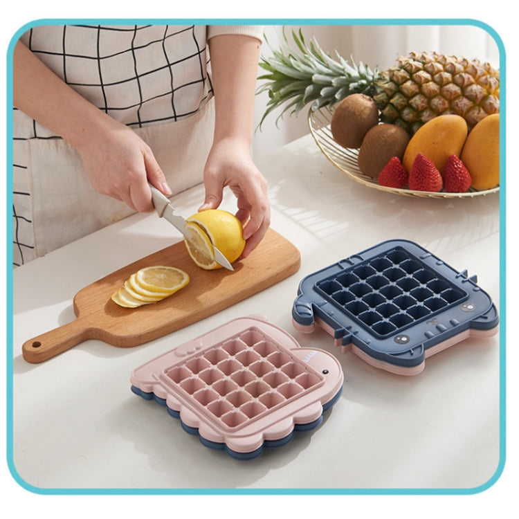 DIY setup with pink and blue animal ice pop molds and sliced fruit