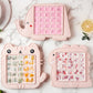 Pink elephant ice pop mold with square cavities, plus two other animal molds