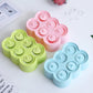 Set of silicone popsicle molds in green, pink, and blue bear shapes with six cavities.