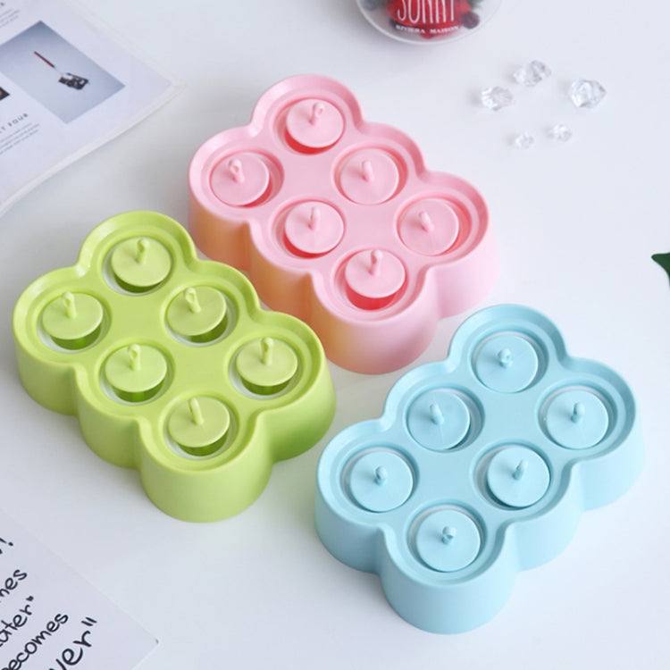 Set of silicone popsicle molds in green, pink, and blue bear shapes with six cavities.