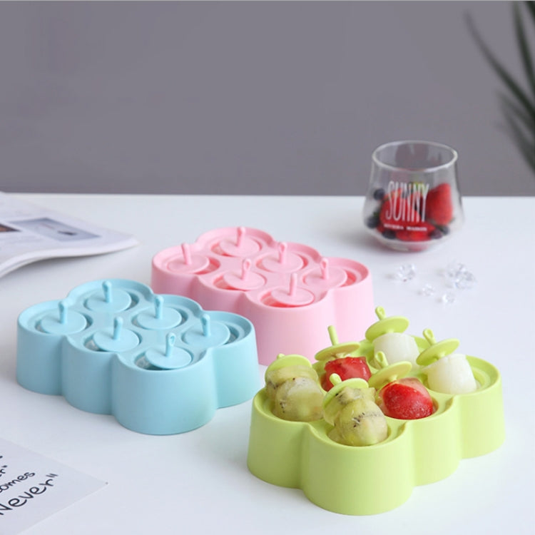Silicone popsicle mold set with lime green, pink, and light blue bear-shaped trays.