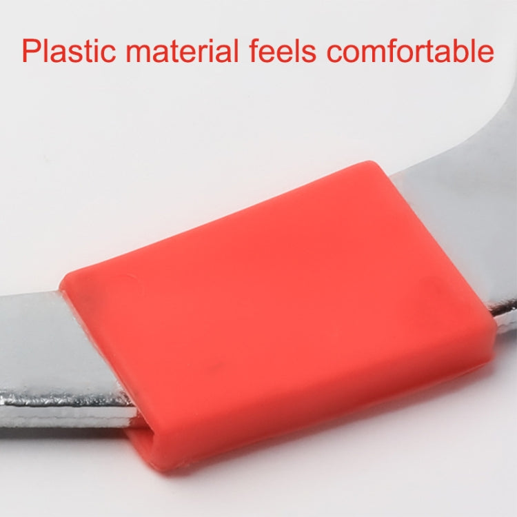 Orange-red plastic grip on three-in-one bicycle wrench, silver metal shaft