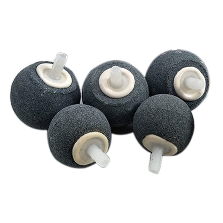 Set of dark gray bubble stones with white air tubes, round porous oxygen diffusers