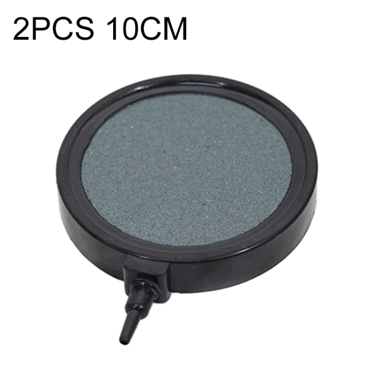 Round bubble tray diffuser with dark gray porous top and black base, air hose outlet