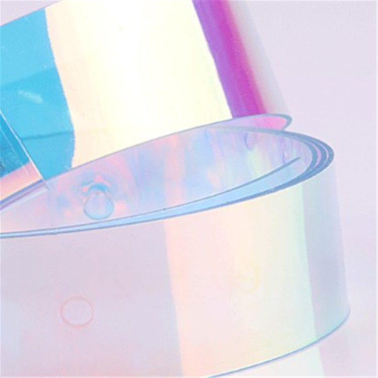 Transparent iridescent belt strap with curved edge and prismatic sheen