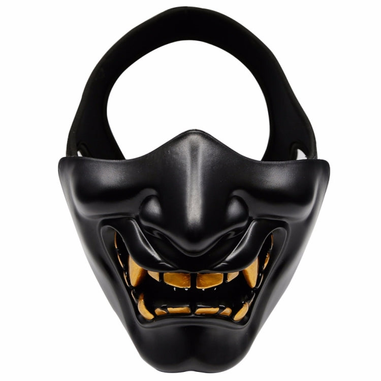 Black half-face tactical grimace mask with open mouth grin and gold-toned teeth