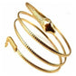 Twisted snake bangle bracelet set with three gold-tone cuffs, raised snake-head details