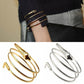 Snake bangle bracelet set worn on wrist, multiple cuffs with snake-head clasp ends