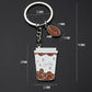 Mini coffee cup keychain with metal ring, chain, and white cup pendant
