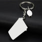 Coffee cup keychain with silver ring, chain, and white metal cup pendant