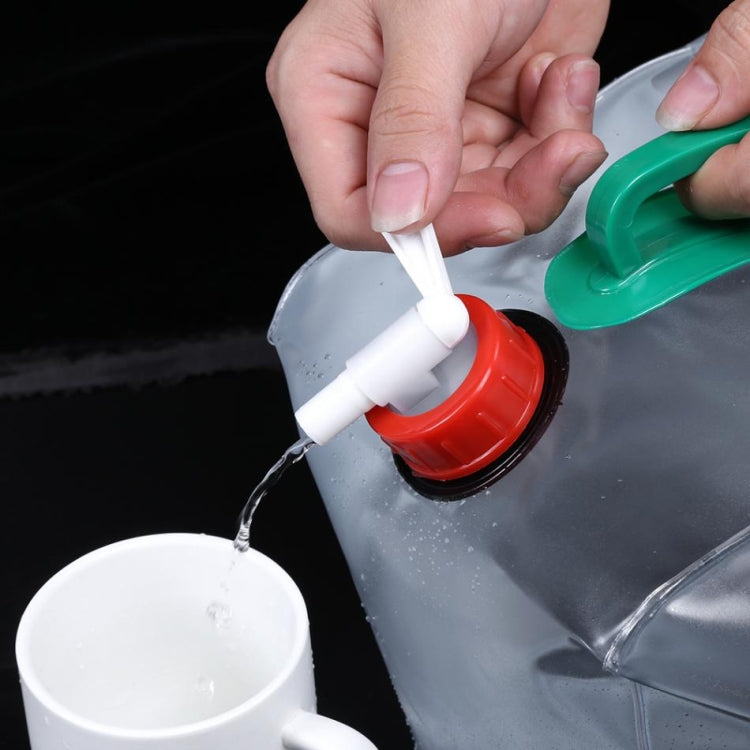 Transparent PVC drinking bag spout with red tap and green handle; pouring water.