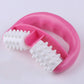 Pink manual plastic two-wheel massager with white spiked rollers