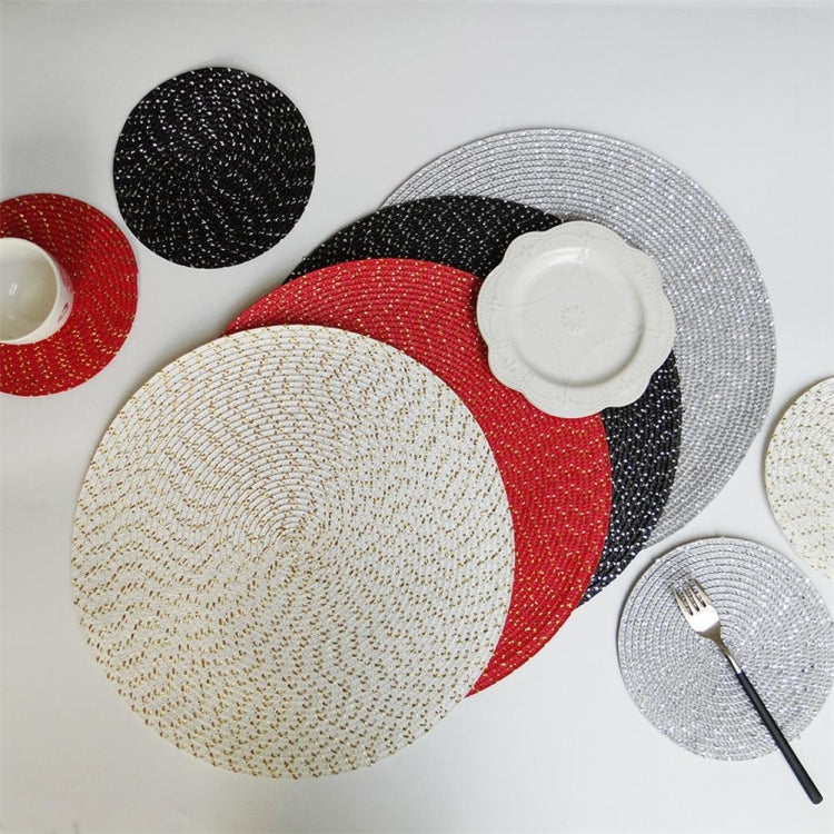 Set of round woven placemats in black, red, white, and gray