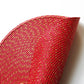 Close-up of red woven placemat with gold-toned speckled strands