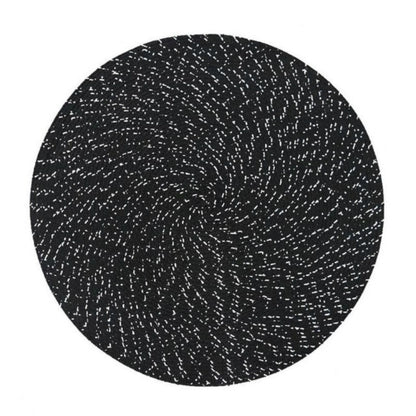Round woven placemat with black and white speckled texture