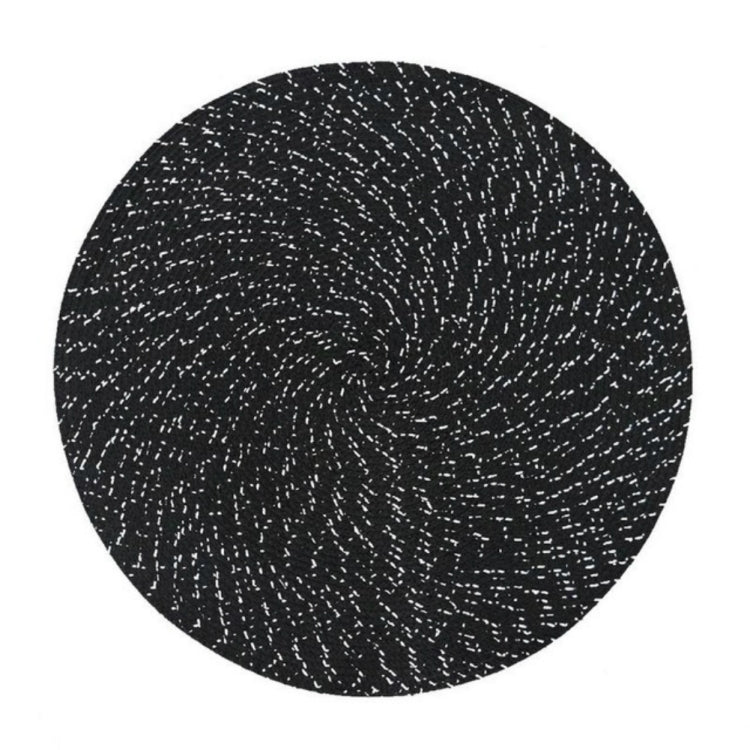 Round woven placemat with dark speckled black and white texture