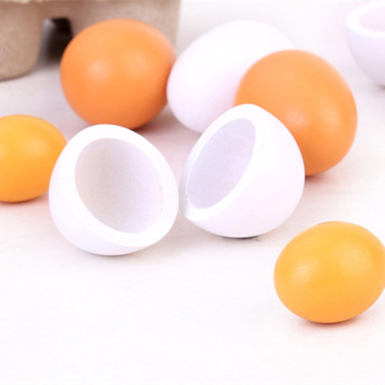 Toy egg halves set with white shells and orange eggs, close-up