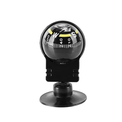 Black suction-mount navigation compass with clear glass dome and marked direction dial