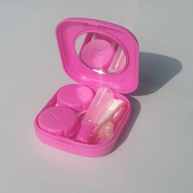 Pink mini square contact lens case with mirror lid, two compartments, and applicators