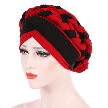 Two-color braided milk silk turban cap, red and black, front view on model
