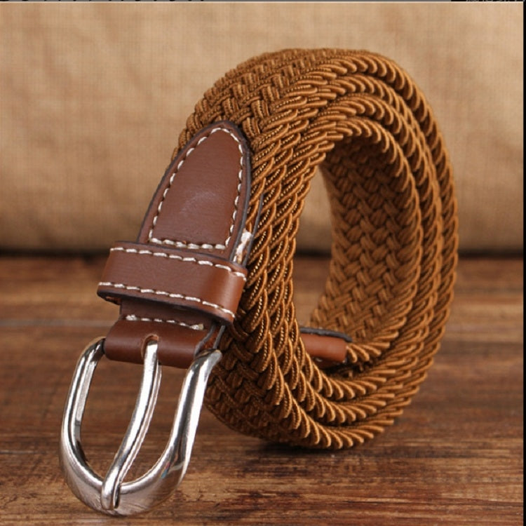 Narrow elastic canvas weave belt with brown leather keeper and silver double-prong buckle.