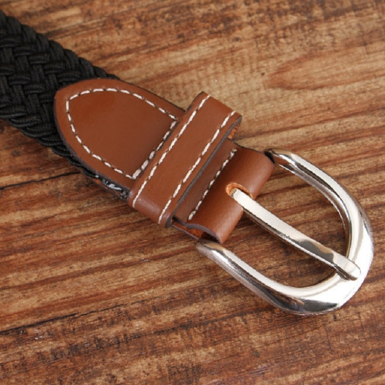 Narrow elastic canvas weave belt with dark brown braid, brown leather end strap, silver buckle.