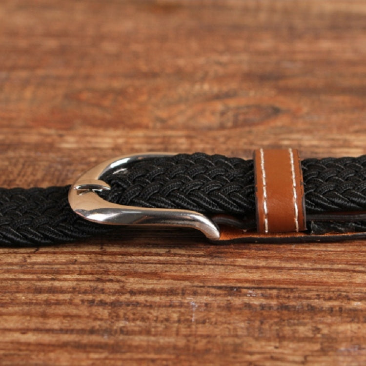 Narrow elastic canvas weave belt with black braided strap and brown leather keeper, silver buckle.