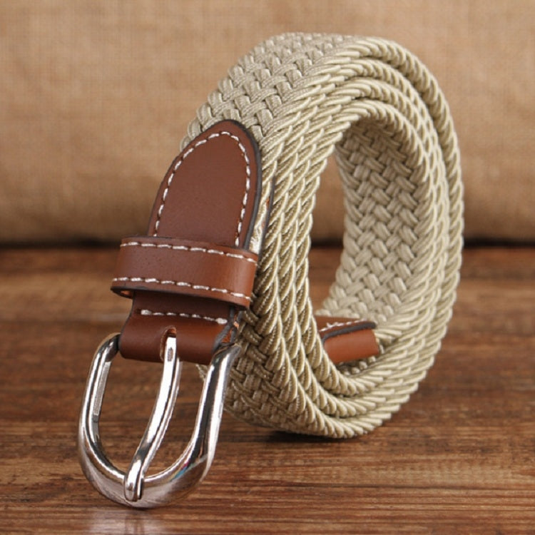 Narrow elastic canvas weave belt with light beige braid, brown leather keeper, silver double-prong buckle.