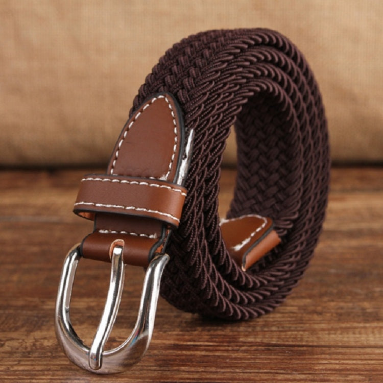Narrow elastic canvas weave belt with dark brown braided strap, brown leather keeper, silver buckle.