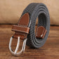 Narrow woven elastic belt with silver buckle, dark gray braided canvas, brown keeper.