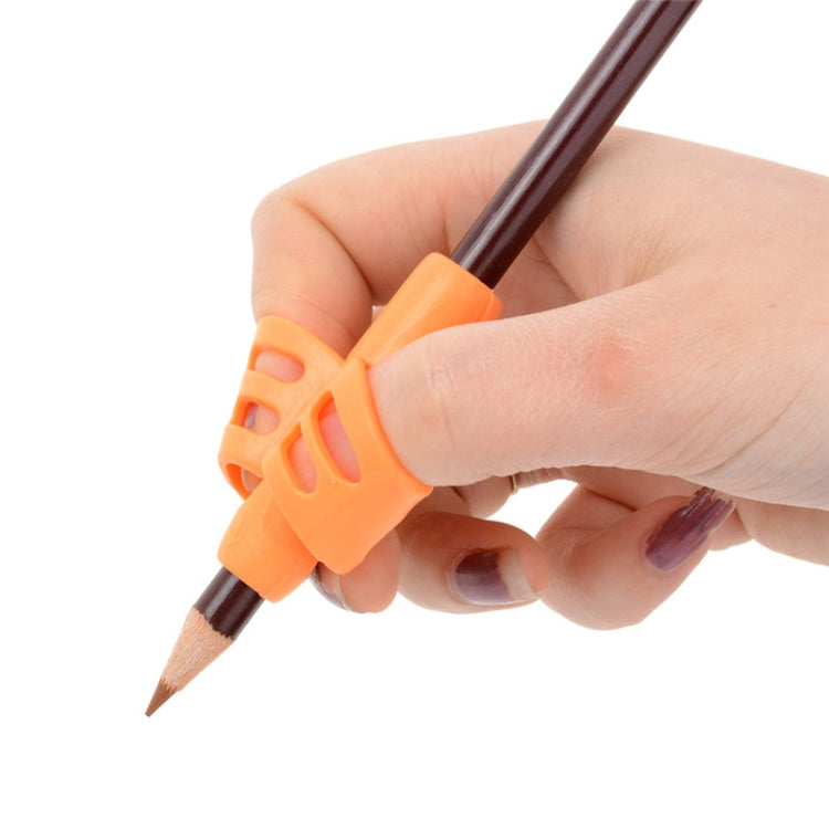 Children's pencil grip aid with orange butterfly holder, held in hand
