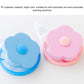Blue and pink laundry filter balls with flower lids and circular release buttons